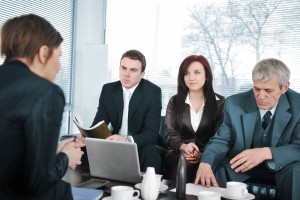Businesswoman in an interview with three business people